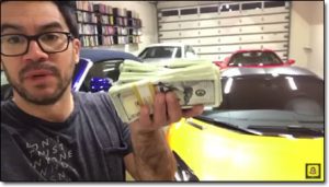 Tai Lopez Holding Money In His Garage